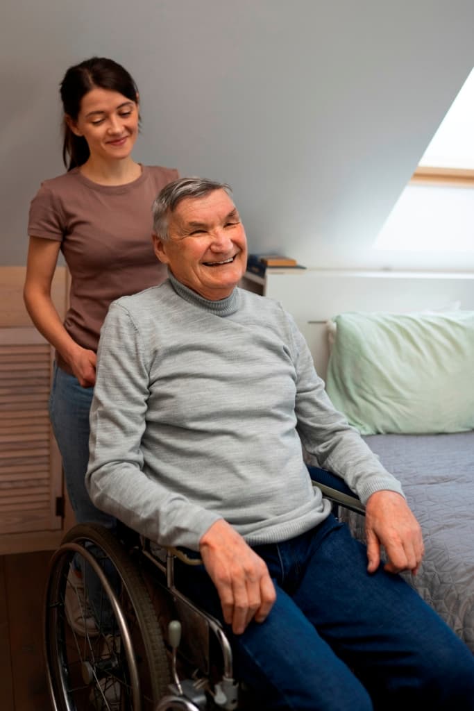 Trained caregiver providing safe patient lifting and transfer assistance in NYC