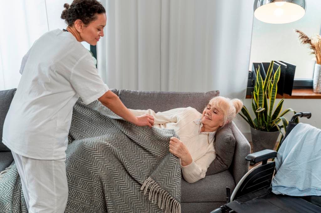 Caregiver supporting a safe recovery at home after hospital discharge in NYC
